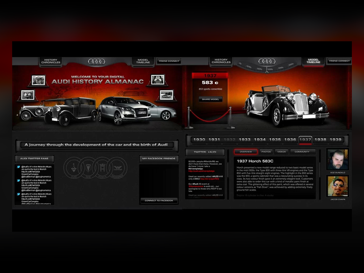 The Audi History Almanac interactive experience home view with the Audi rings, a car lineup, and a vintage Horch.